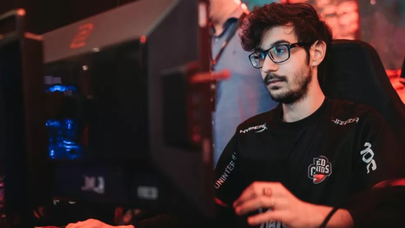 Revolts with the RED Canids shirt and sits in front of the computer