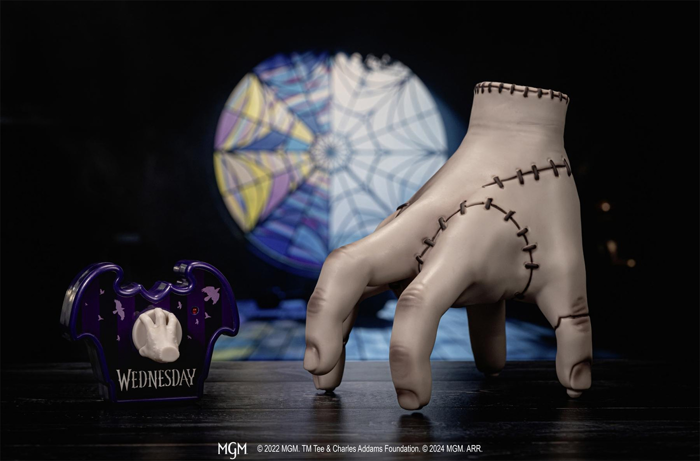 Hand (Thing) with remote control of the Wandinha series (Wednesday)